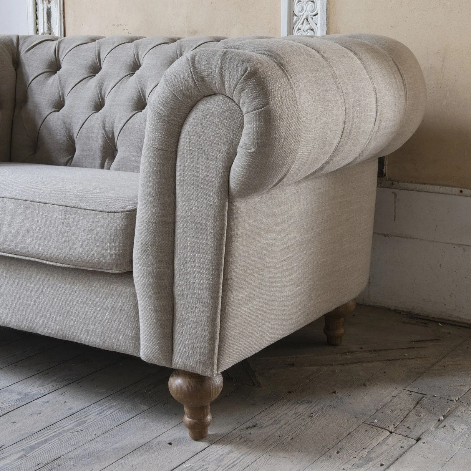 Two seater button back linen sofa